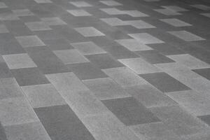 Gray Stone Tile Floor Pattern Background. a modern gray stone tile floor with a geometric rectangular pattern. photo