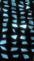 Abstract glowing shards scattered on a dark background, creating a futuristic and fragmented visual pattern video