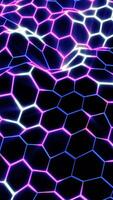 Vibrant glowing hexagonal grid in blue and pink neon forming a dynamic, flowing digital surface video