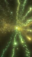 Abstract green and gold glowing particles and trails moving through a deep space background video