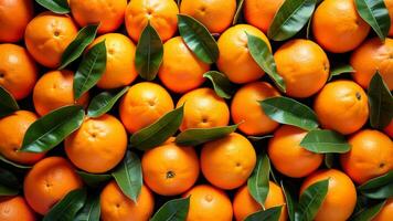 Oranges with green leaves, fills the frame, arranged closely together. Useful for illustrating healthy food, citrus fruit, or natural produce concepts. photo