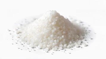 A mound of coarse salt isolated on a white background for culinary or ingredient use. For food, cooking, or seasoning context. photo