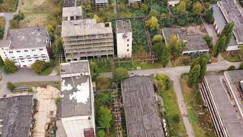 Old manufacture from above. Abandoned industrial territory with old buildings and warehouses. Empty factory. Orbital view. video