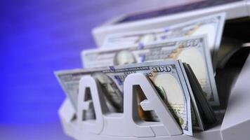 Counting hundred of dollar bills in bank. Financial operation on a modern electronic cash counting machine. Automatic equipment for counting paper money. video