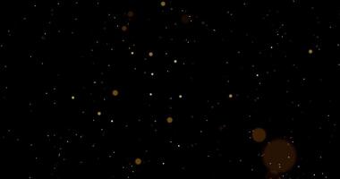 Falling sparkling gold bokeh particles on a black background. Abstract animation.856 video