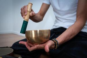 Tibetan Chanting Bow with man's hand photo