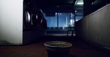 Detailed CGI Empty bucket in a dimly lit laundromat during late night hours video