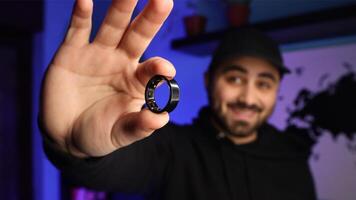 Man holding a smart ring photo