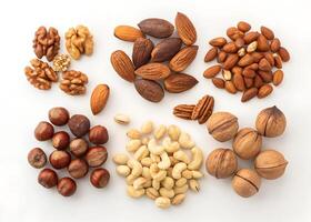 Nuts Mix on White Background Variety of Whole and Shelled Edible Nuts photo