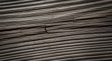 close up of rustic weathered wooden surface with deep cracks and rough texture photo