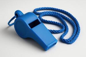 Vibrant matte blue whistle with matching twisted lanyard on a clean background photo