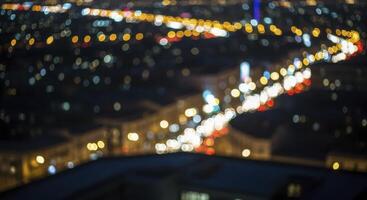 Vibrant blurred city lights and car traffic at night creating a beautiful bokeh effect photo