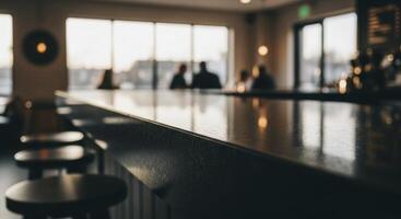 Sleek dark granite bar countertop in a modern cafe with blurred background photo