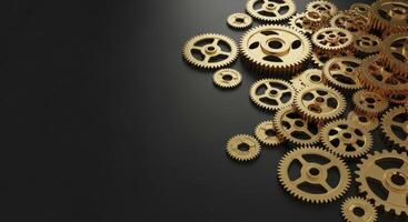 Gleaming golden gears scattered on a dark matte black surface photo