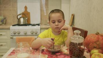 Little Boy Doesnt Want To Eat Chocolate Balls For Breakfast And Shows It With His Behavior. Gimbal shot. video