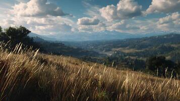 Golden grassland swaying gently in breeze against backdrop of rolling hills and majestic mountain range photo
