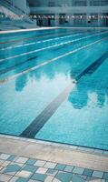 Tranquil turquoise depths the shimmering allure of a pristine swimming pool reflecting the endless sky above serene waters photo