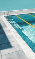 Serene turquoise swimming pool with calm water and modern architecture creating a tranquil escape retreat oasis photo