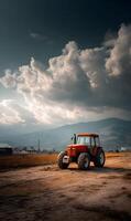 Red tractor standing in a vast field beneath a dynamic sky with dramatic cloud formations and distant mountains photo