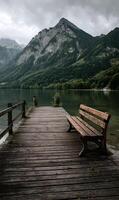 Idyllic Mountain Lake Scenery Calm Water Serene Bench Scenic Destination Quiet Relaxation Wooden photo