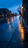 Urban street scene at twilight reflecting streetlights on wet pavement after rain creating moody photo