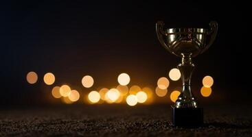 Golden trophy shines against a dark bokeh background symbolizing ultimate victory and achievement in a contest photo