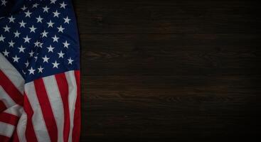 American flag rests on rustic wooden background for patriotic celebrations photo