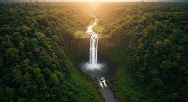 Tad Fane Waterfall plummets through vibrant rainforest creating breathtaking natural beauty in Laos Southeast Asia photo