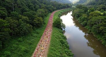 Cultural procession alongside a river showing a vibrant celebration in a lush green forest representing community and tradition photo