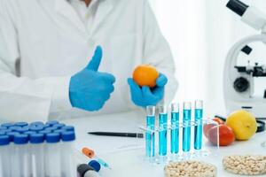 Scientist guaranteer no chemical on fruit residues in laboratory. Control experts inspect the concentration of chemical residues, standard, find prohibited substances, contaminate. photo