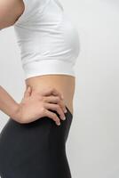 Diet woman on weight scale, results of diet. Beautiful shape. reduced waist size after under going a weight loss corse. balance, control, routines, exercise. photo