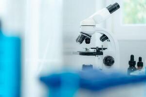 Scientist analyze biochemical samples in advanced scientific laboratory. Medical professional use microscope look microbiological developmental of viral. Biotechnology research in science, photo