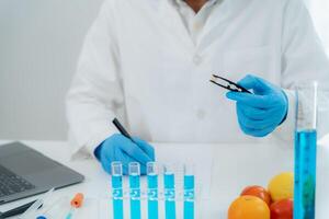 Scientist check chemical whole grains residues in laboratory. Control experts inspect the concentration of chemical residues. hazards, standard, prohibited substances, contaminate. Microbiologist, photo