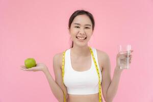 slim body asian women choose healthy foods, dieting female choose green apple for diet. Good healthy food. weight lose, balance, control, reduce fat, low calories, routines, exercise. photo