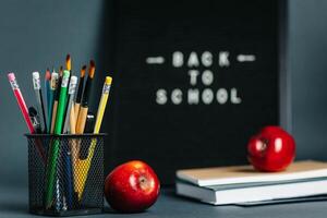Back to School Message on Felt Board with Pencils and Apples photo