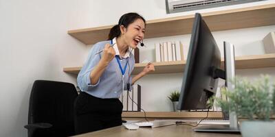 Triumphant Customer Service Agent. Female representative expressing joy after resolving client issues. photo