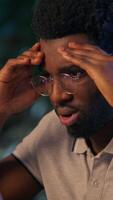 Overworked stressed businessman African American business man in office problem laptop working online mistake failure upset trouble computer overtime night evening job disappointed sad tired employer video