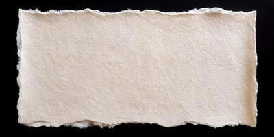Cream Textured Paper Piece Torn Edges Black Background photo