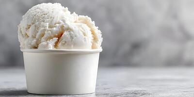 Closeup of Creamy Vanilla Ice Cream in a Small Paper Cup photo