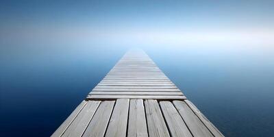 Wooden Dock Extending into Misty Lake Peaceful Calm Serenity Scene photo