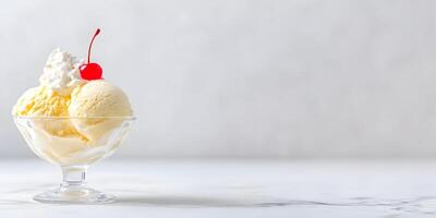 Vanilla Ice Cream Sundae with Whipped Cream and Cherry Garnish in Glass Bowl photo