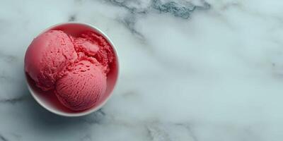 Pink Ice Cream Scoops in White Bowl on Marble Background photo