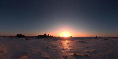 Sunset over Snowy Landscape with Rock Formations photo