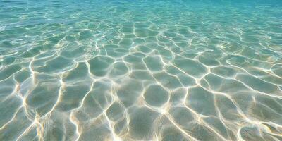 Shallow Clear Ocean Water Sunlight Reflection Sandy Seabed Summer Beach Scene photo