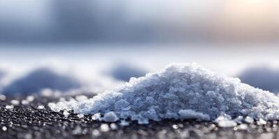 Closeup of Melted Snow Pile on Dark Surface Winter Scene Ice Crystals photo