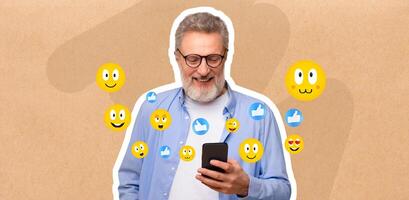 Senior man with glasses smiles while chatting on his smartphone. Surrounded by cheerful emojis, he enjoys his time on social media. The setting suggests a relaxed atmosphere, perfect for connection. photo