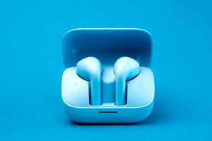 A pair of stylish wireless earbuds inside an open charging case, set against a vibrant blue background. Compact, portable, and modern design, ideal for music lovers and tech enthusiasts photo