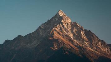 A Grand Mountain Summit Bathed In The Warm Golden Hour Light photo