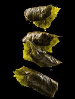 An Artistic Cascade Of Falling Dolmades Appetizers photo