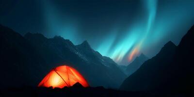 Illuminated Camping Tent in Mountain Range under Aurora Borealis photo